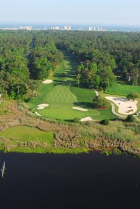 Tidewater Golf and the Atlantic Intracoastal Waterway looking green to tee at the 16th hole in North Myrtle Beach SC South Carolina