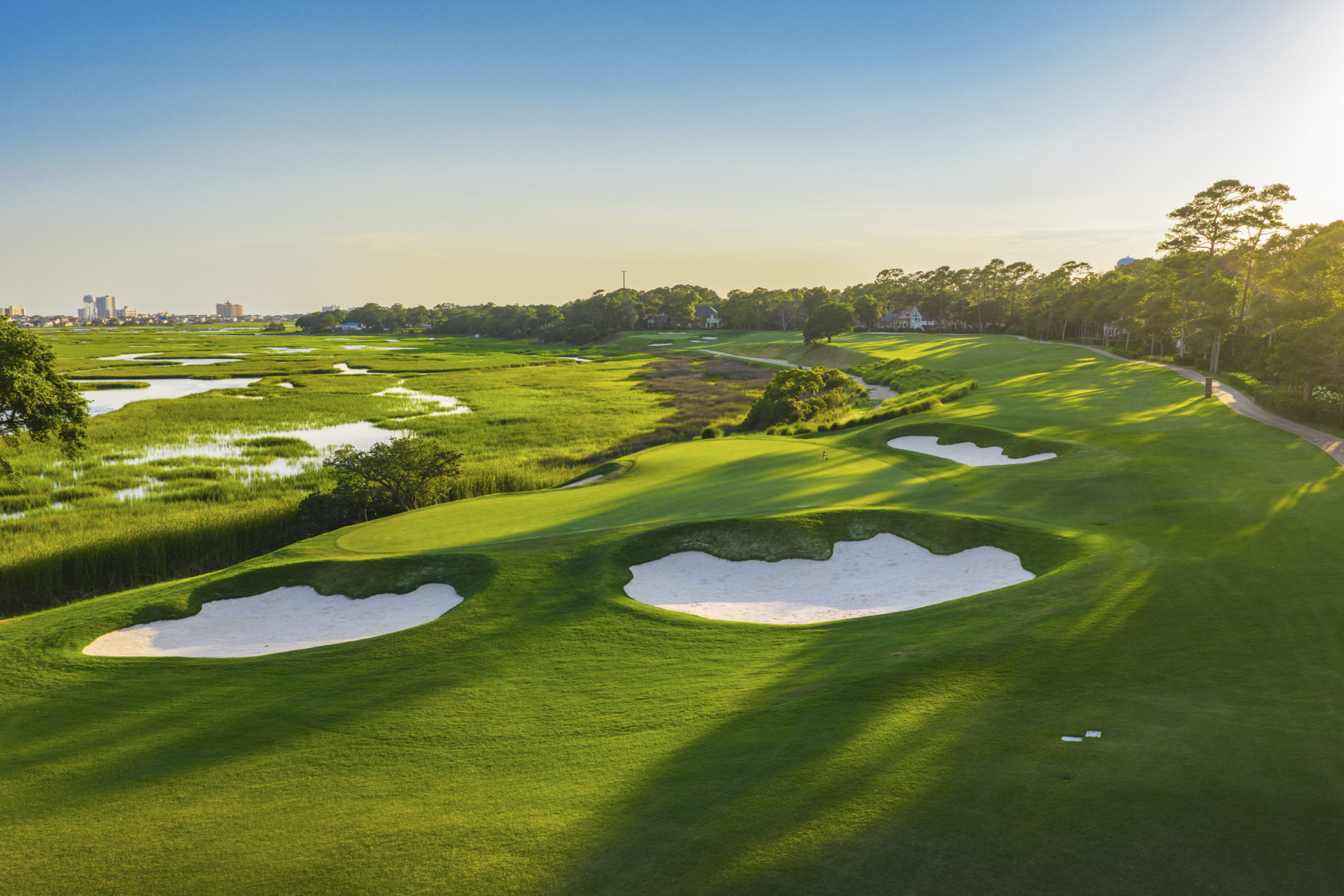 Hole 3 green at Tidewater Golf Club in North Myrtle Beach, SC with the Cherry Grove Marsh in the background